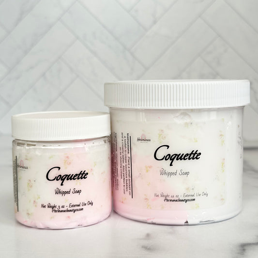 Whipped soap jars swirled with white and pink soap and floral printed label