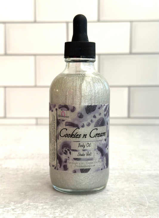 Body Oil in glass bottle with black dropper top. The label is black and gray and has cookies on it