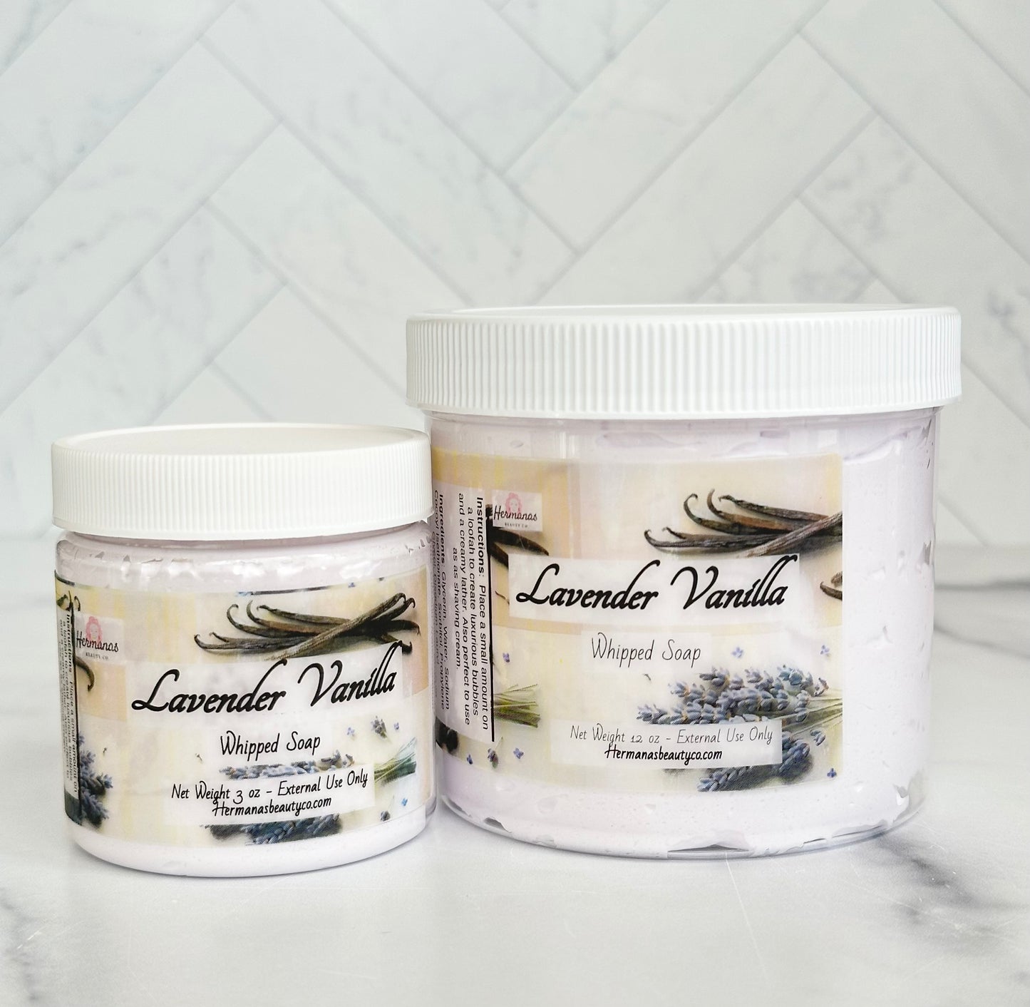 Lavender and vanilla whipped soap jars with white lids and colorful labels