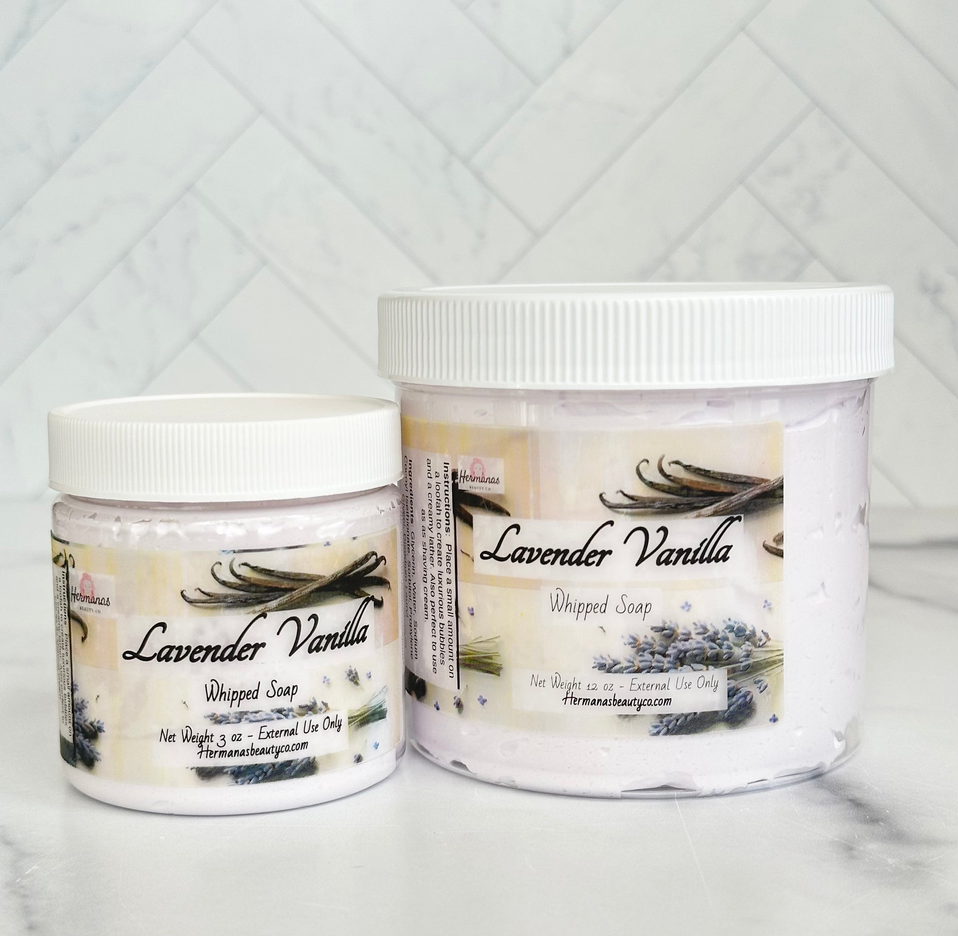 Lavender and vanilla whipped soap jars with white lids and colorful labels