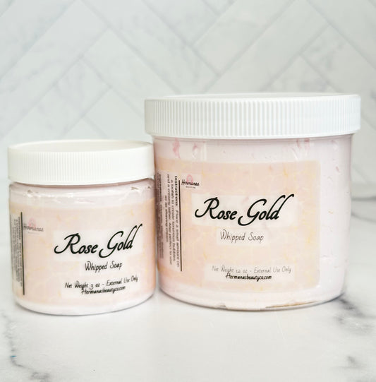 Jars of light pink whipped soaps with gold swirls and pink printed labels