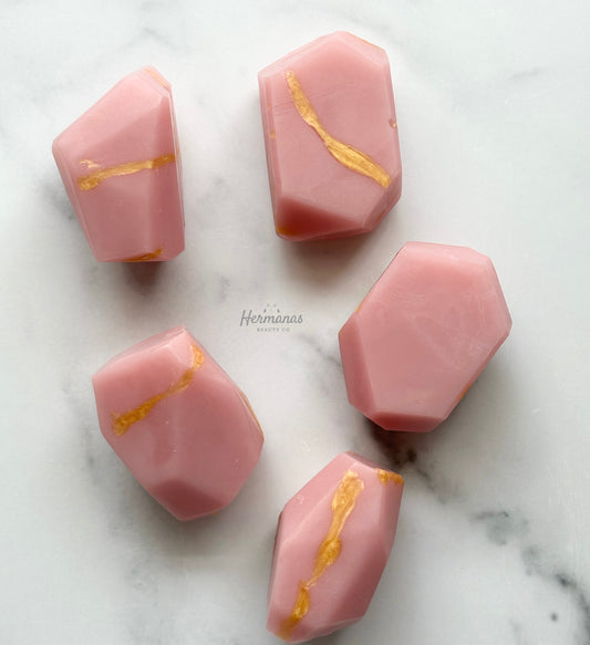 Pink soap shaped as gemstones with gold swirl